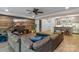 This living room features a wood accent wall, a sectional couch, and a bar area at 3678 Rankin Rd, Concord, NC 28027