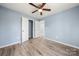 Bedroom featuring vinyl flooring, freshly painted walls, and a ceiling fan at 108 W Maryland Ave, Bessemer City, NC 28016