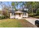 Charming home with neutral siding, decorative shutters, and a well-manicured front yard at 108 W Maryland Ave, Bessemer City, NC 28016