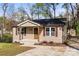 Charming single-story home featuring a cozy front porch and well-maintained landscaping at 108 W Maryland Ave, Bessemer City, NC 28016