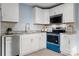 Stylish kitchen with white cabinets, stainless steel appliances, and granite countertops at 108 W Maryland Ave, Bessemer City, NC 28016