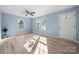 Open-concept living room featuring a ceiling fan, recessed lighting, and gleaming wood floors at 108 W Maryland Ave, Bessemer City, NC 28016