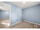 A flex space with vinyl flooring and freshly painted walls, with washer and dryer hookups at 108 W Maryland Ave, Bessemer City, NC 28016