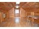 Spacious attic featuring wood paneling, hardwood floors and good lighting at 115 Turner St, Lincolnton, NC 28092