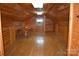 Spacious attic featuring wood paneling, hardwood floors and good lighting at 115 Turner St, Lincolnton, NC 28092
