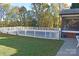 Fenced-in pool area with a surrounding grass lawn and screened-in porch in the background at 115 Turner St, Lincolnton, NC 28092