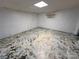 Unfinished basement with painted concrete floors, white walls and ceiling at 115 Turner St, Lincolnton, NC 28092