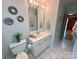 Bright bathroom with double sinks, white cabinets, and decorative mirrors at 115 Turner St, Lincolnton, NC 28092