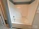 This bathroom features a molded white shower and tub combo with chrome fixtures at 115 Turner St, Lincolnton, NC 28092