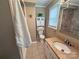 Well-lit bathroom with granite countertop, white cabinets, and decorative touches at 115 Turner St, Lincolnton, NC 28092