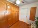 Bedroom with a large wall of storage cabinets and hardwood floors at 115 Turner St, Lincolnton, NC 28092