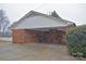 Carport area with brick foundation and a white awning at 115 Turner St, Lincolnton, NC 28092