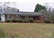 Charming brick home with mature landscaping and inviting front entrance at 115 Turner St, Lincolnton, NC 28092