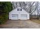 A detached two car garage with white siding at 115 Turner St, Lincolnton, NC 28092