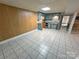 Kitchen with tiled floor and muted blue wooden cabinets, offering ample storage at 115 Turner St, Lincolnton, NC 28092