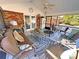 Relaxing screened porch with comfortable seating, a ceiling fan, and views of the backyard at 115 Turner St, Lincolnton, NC 28092