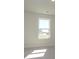 Vacant bedroom has carpet and a window overlooking the neighborhood at 145 Halite Way, Waxhaw, NC 28173
