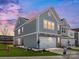 Charming two-story home featuring a two-car garage, craftsman details, and a beautifully landscaped front yard at 145 Halite Way, Waxhaw, NC 28173