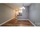 Dining area with hardwood floors adjacent to the kitchen at 18710 Oakhurst Blvd # B1F, Cornelius, NC 28031