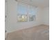 Sunlit bedroom featuring neutral carpet and two windows for ample natural light at 2507 Andes Dr, Statesville, NC 28625