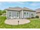 Charming backyard with an outdoor dining space and well-maintained lawn, great for relaxing or entertaining at 3848 Zemosa Nw Ln, Concord, NC 28027