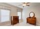 Cozy bedroom featuring classic wooden furniture and natural light at 3848 Zemosa Nw Ln, Concord, NC 28027
