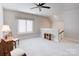 Spacious bonus room with neutral carpet and a ceiling fan at 3848 Zemosa Nw Ln, Concord, NC 28027