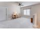 Open bonus room with neutral carpet and a ceiling fan at 3848 Zemosa Nw Ln, Concord, NC 28027
