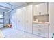 Well-organized garage featuring ample cabinets and drawer space providing plenty of storage at 3848 Zemosa Nw Ln, Concord, NC 28027