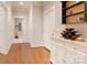 Inviting hallway boasts hardwood floors and complements the white trim work and neutral wall color at 3848 Zemosa Nw Ln, Concord, NC 28027