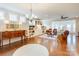 Warm and inviting living room with hardwood floors, built-in bookcases, and comfortable seating arrangements at 3848 Zemosa Nw Ln, Concord, NC 28027