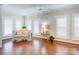 Sunlit living room with hardwood floors and classic furnishings at 3848 Zemosa Nw Ln, Concord, NC 28027