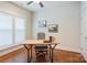 Bright office space with wood floors, a ceiling fan, and a large window providing ample natural light at 3848 Zemosa Nw Ln, Concord, NC 28027