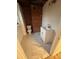 Basement bathroom with white vanity, marble-look tile, and exposed brick at 912 Surry Dr, Shelby, NC 28152