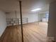 Finished basement with vinyl flooring, built-in shelving, and laundry area at 912 Surry Dr, Shelby, NC 28152