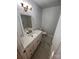 Updated bathroom with white vanity and marble tile at 912 Surry Dr, Shelby, NC 28152