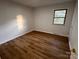 Charming bedroom with wood-look floors and a window at 912 Surry Dr, Shelby, NC 28152