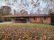 Brick ranch home with attached carport and landscaped yard at 912 Surry Dr, Shelby, NC 28152