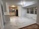 Updated kitchen with white cabinets and marble-look tile floors at 912 Surry Dr, Shelby, NC 28152