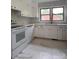 This kitchen features white cabinets, sleek appliances, and plenty of counter space at 912 Surry Dr, Shelby, NC 28152