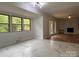 Bright open-concept living room with marble tile transitioning to beautiful hardwood floors at 912 Surry Dr, Shelby, NC 28152