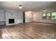 Living room featuring hardwood floors, a fireplace with built-ins, and ceiling fans at 912 Surry Dr, Shelby, NC 28152