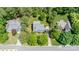 An aerial view of the property shows a well-maintained house with a green lawn and mature trees at 107 Monterey Dr, Mooresville, NC 28117
