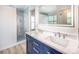Primary bathroom featuring a walk-in shower and dual-sink vanity at 107 Monterey Dr, Mooresville, NC 28117