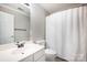 Bright bathroom featuring a vanity, toilet, and shower with curtain at 107 Monterey Dr, Mooresville, NC 28117