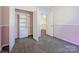 Cozy carpeted bedroom featuring a closet with shelving and a connecting door at 107 Monterey Dr, Mooresville, NC 28117