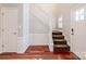 Inviting foyer features hardwood floors, staircase, and white trim at 107 Monterey Dr, Mooresville, NC 28117