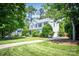 Exterior view showcasing a two-story home with well-maintained landscaping and a lush green lawn at 107 Monterey Dr, Mooresville, NC 28117