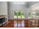 Bright living room with fireplace, hardwood floors, and large windows at 107 Monterey Dr, Mooresville, NC 28117