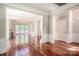 Open-concept living room featuring hardwood floors and elegant trim at 107 Monterey Dr, Mooresville, NC 28117